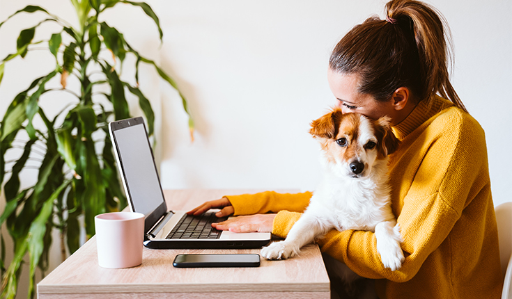 51-woman-works-from-home-with-puppy_735x430_51